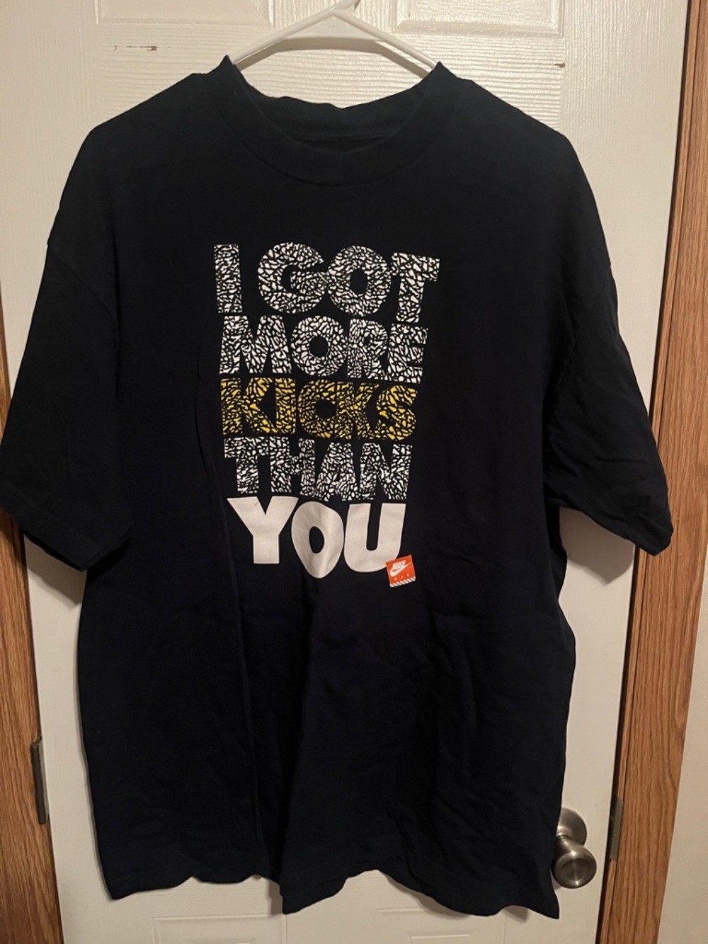 Black Graphic Tee with 'I Got More Kicks Than You'